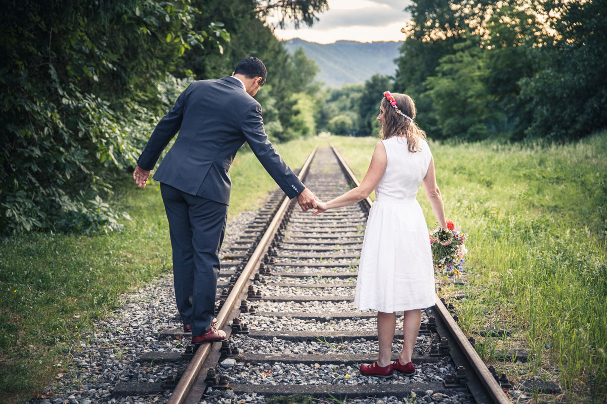 Portrait of Martina and Michele in train rails